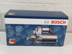 An as new Bosch starter motor (REF: 0 986 021 480 - 9EG).