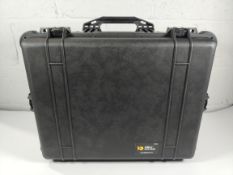 A Peli 1610 wheeled hard case with foam internals, external size H62.7 x W49.7 x D30.3cm, black, wat