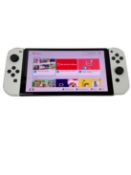 Pre-owned Nintendo Switch OLED Handheld Console (M/N: HEG-001) (Factory reset, sold as seen),