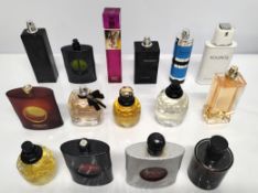 Thirty YSL perfumes/testers and related (please note: bottles may have been used/packaging may have