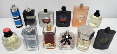 Thirty YSL perfumes/testers and related (please note: bottles may have been used/packaging may have