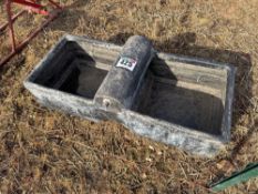 Small black plastic water trough