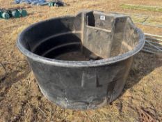 Large black plastic water trough