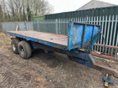 1974 twin axle flat bed trailer with metal floor. On 12.5/80-15.3 wheels and tyres
