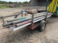 Quantity horse jump poles on single axle transport trailer