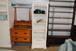 A white painted bookcase fitted two drawers