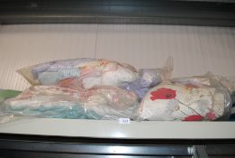 Two bags of various sheets and duvet covers and a bag of various bed linen etc