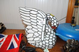 A Tiffany style table lamp in the form of a swan