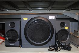 Three Logitech speakers