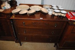 An oak chest fitted three long drawers