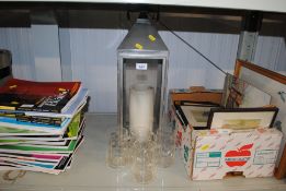 A candle lantern and various glass ware