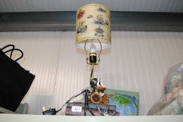 A decorative table lamp and shade