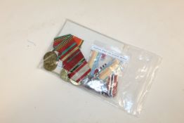 A pair of medals to A.J. Snyders SAF; a pair to A.