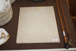 A folder containing seven coloured plates 