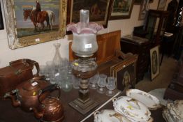 A brass based oil lamp with cut glass font and sha