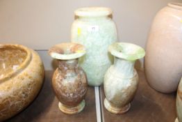 An onyx vase 32cm high and a pair of onyx baluster