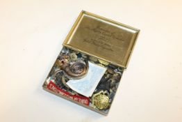A Queen Elizabeth II Gift Tin containing various b