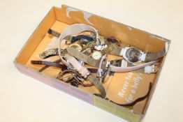 A box containing various wrist watches