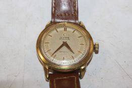 A Cyma gold plated cased automatic wrist watch