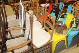 A set of four ladder back dining chairs