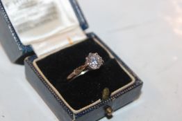 A silver dress ring, set solitaire white stone siz