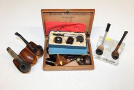 A Pukeberg Sweden glass pipe rest; a carved wooden