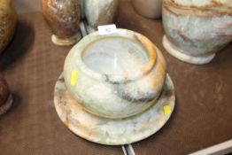 An onyx jardinière 20cm dia. and an onyx stand 27.