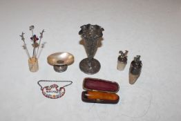 A box containing white metal hat pins, Eastern whi