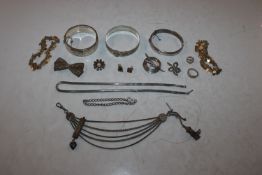 Two silver snap bangles; one other silver bangle a