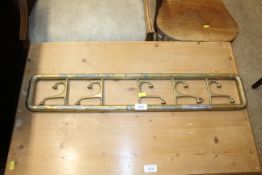 A set of brass coat hooks