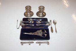 A pair of Sterling silver candlesticks with weight
