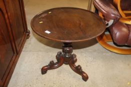 A 19th Century circular topped side table raised o