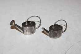 A Sterling silver salt and pepper pot in the form