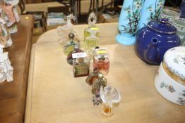 A quantity of perfume bottles - some with contents