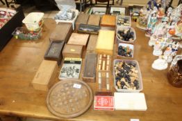 A large quantity of various chess pieces, cribbage