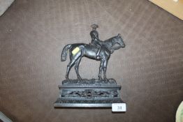 An antique Boer War period cast iron door stop dep