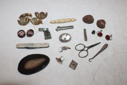 A box containing mother of pearl pen knife, button