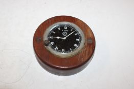 A Jaeger Paris clock in wooden surround