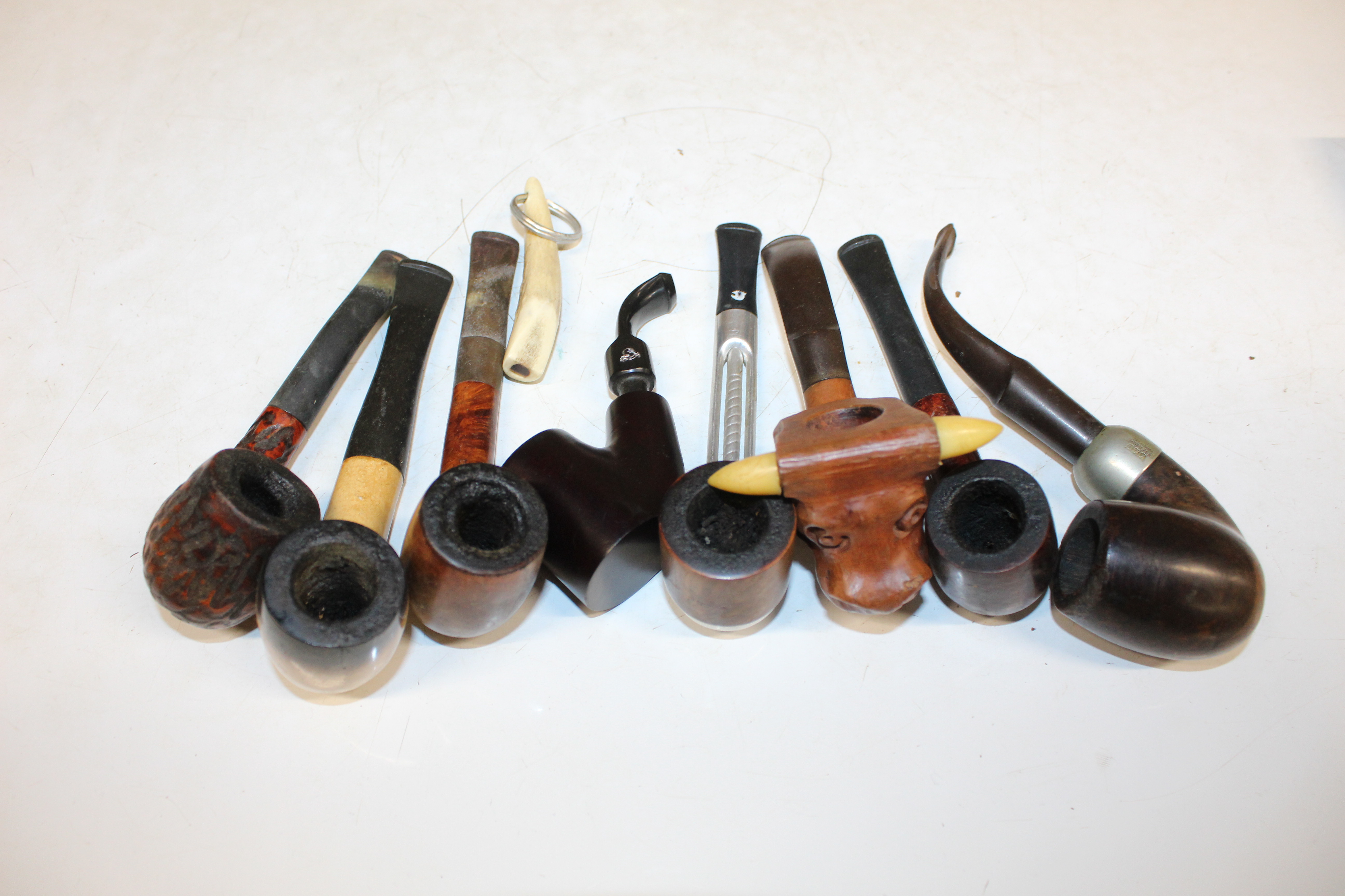 A Pukeberg Sweden glass pipe rest; a carved wooden - Image 9 of 11