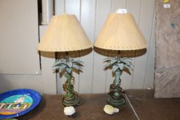 A pair of decorative table lamps in the form of pa