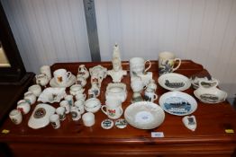 A collection of various crested china to include W.H. Goss