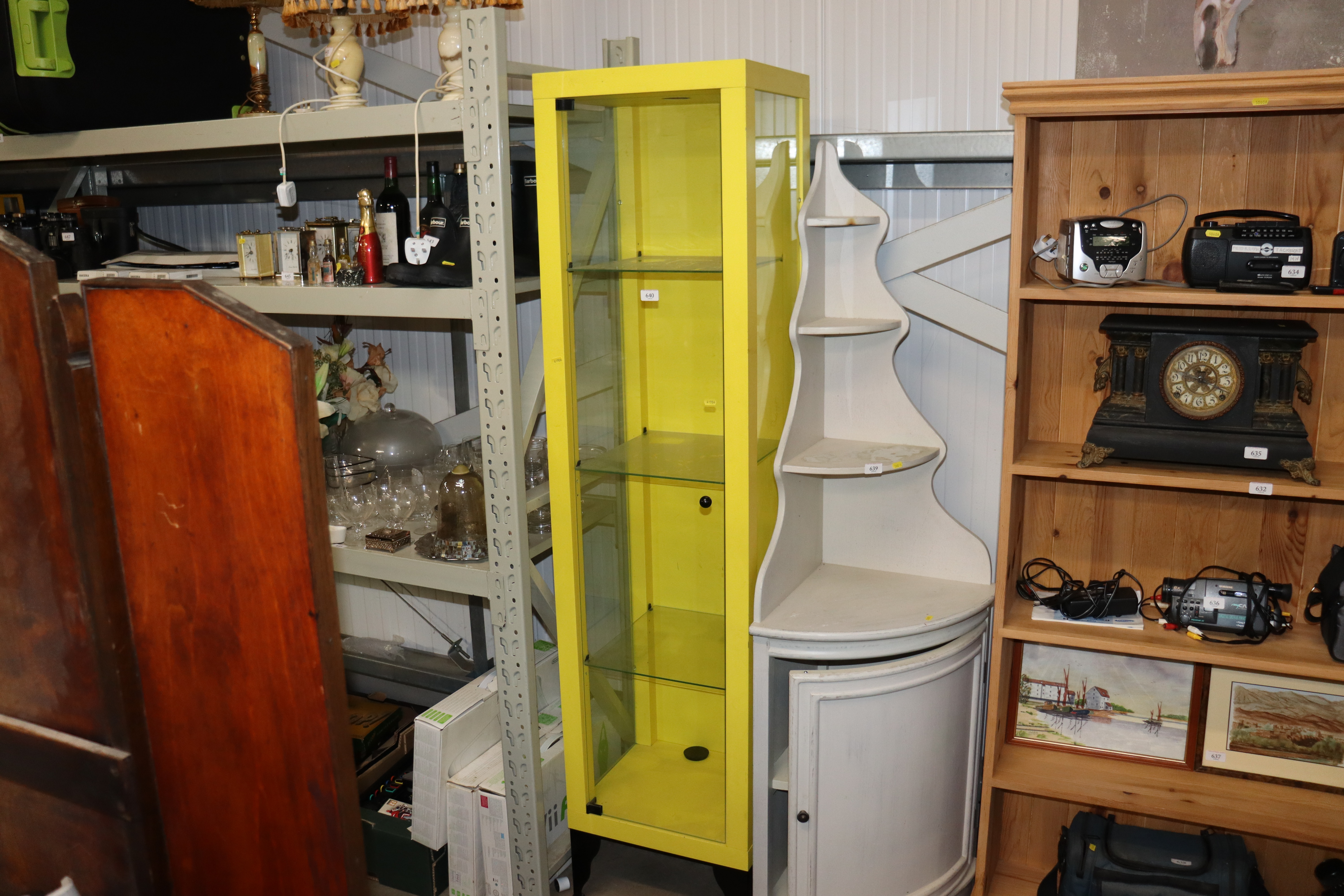 A wooden and glass display unit