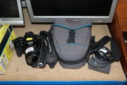 A Canon EOS 400D digital camera, together with var