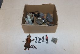 A box containing lead figures and various ornament