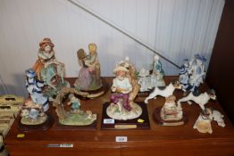 A collection of various figures and ornaments to include Capo Di Monte style etc