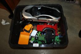 A box containing various die-cast vehicles etc