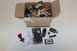 A silver propelling pencil, two silver thimbles, a