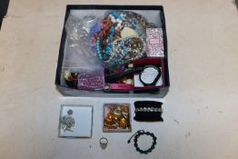 A box containing various costume jewellery to incl