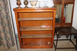 A stained pine book case (adapted).