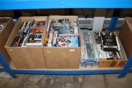 Four boxes containing various DVD's